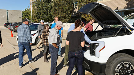 DEQ employees grab drinks from the truck’s front trunk, or “frunk.”