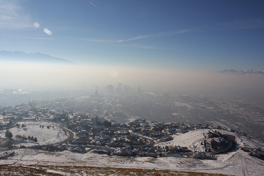 Employer-based trip reduction programs can reduce the pollution trapped near the ground during inversions. Photo shows polluted air over Salt Lake City.