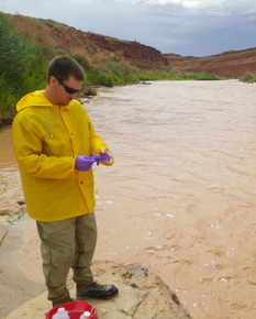 DEQ scientist sampling on the San Juan River