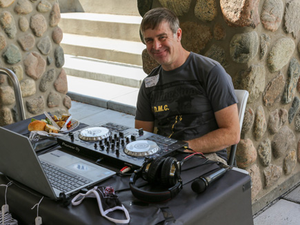 DEQ Employee volunteer DJ. Looks like he is playing "Never Gonna Give You Up"