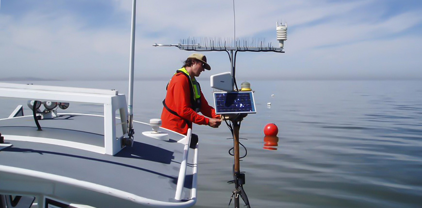 Impressive picture of a USGS guy working on a boat from Great Salt Lake