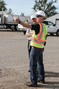 Division of Waste Management and Radiation Control employee inspecting a waste site.